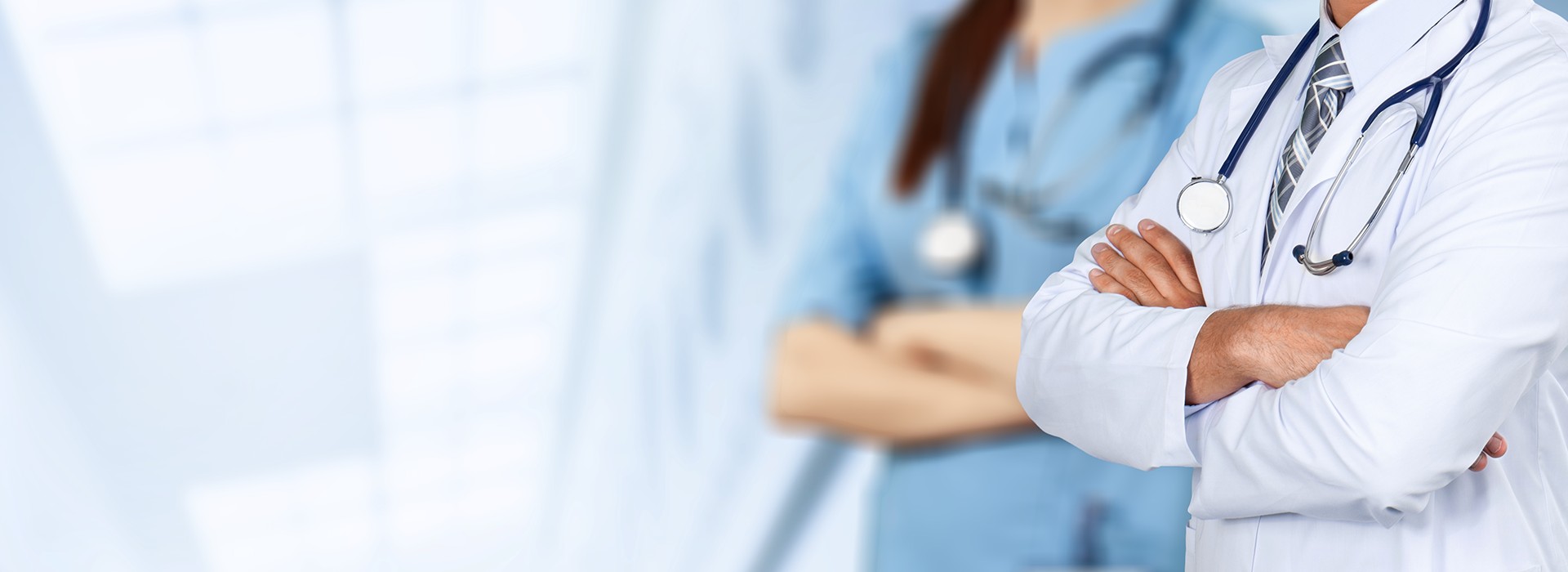 Two doctors waiting to help a patient.